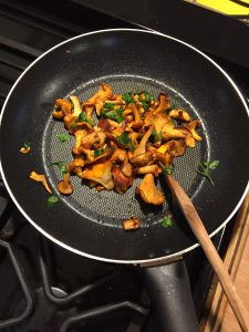 Foraged mushrooms in a frying pan