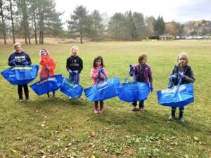 Elementary school students completing the Trash Trackers program 
