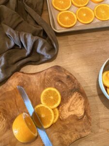 Oranges being cut into slices 