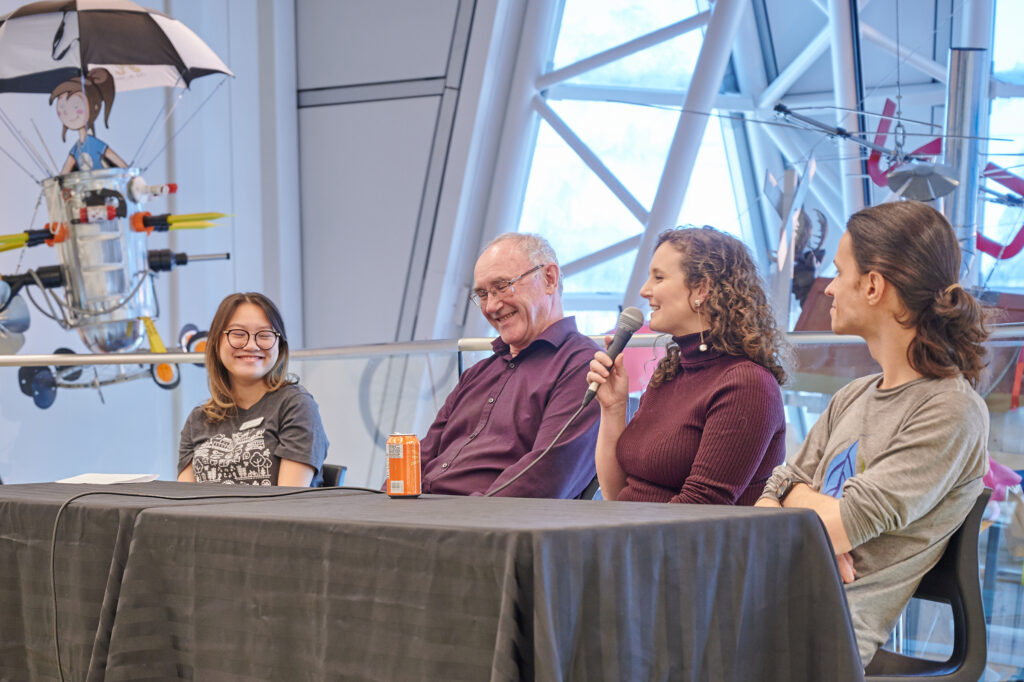 Three panelists and a staff member from The Gaia Project at a Green Experts panel