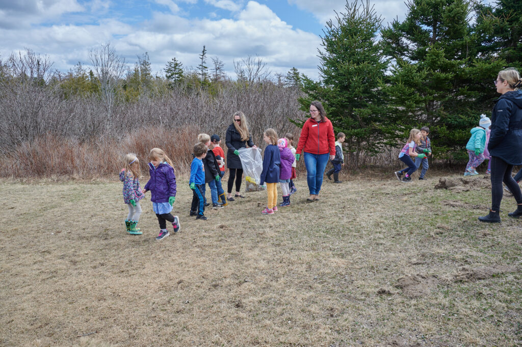 The students collect litter on the school grounds