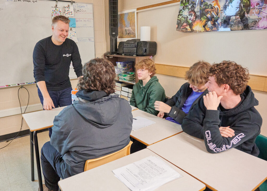 Jimmy speaking with students during a Climate Action Project program 