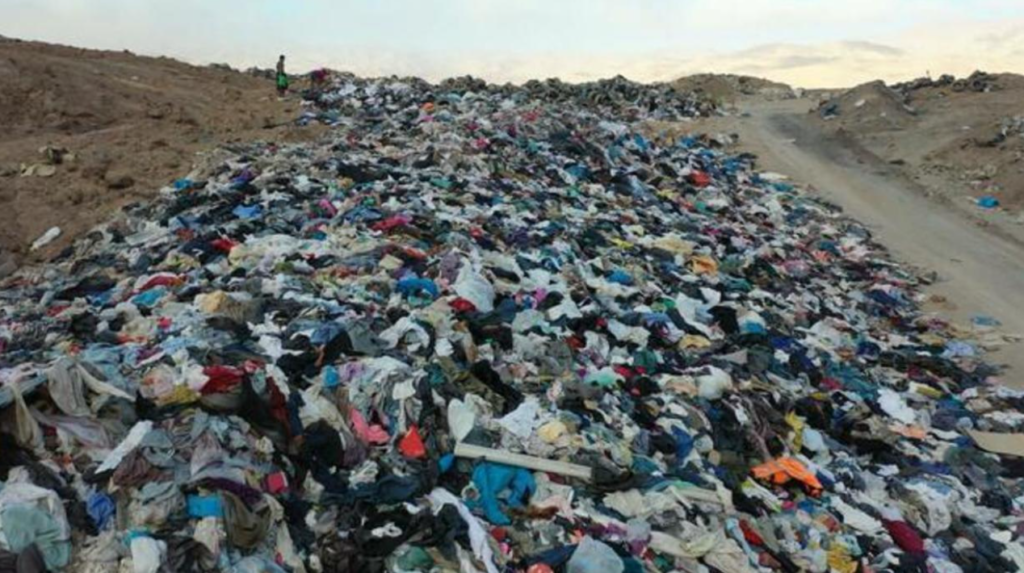 A photo of clothes in a landfill 