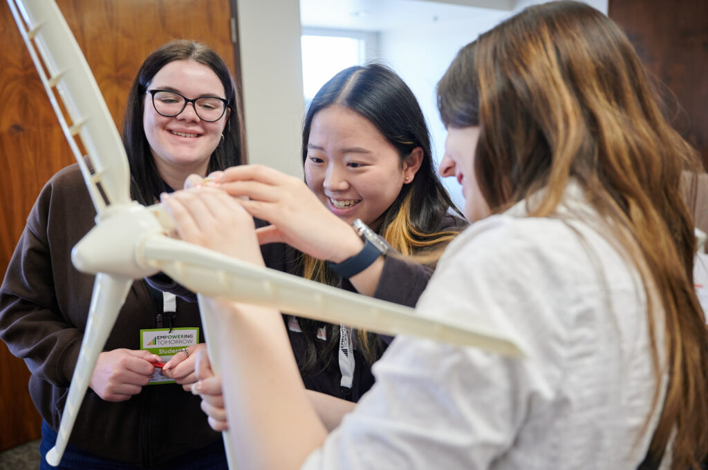 Three teens participate in a wind turbine building workshop 