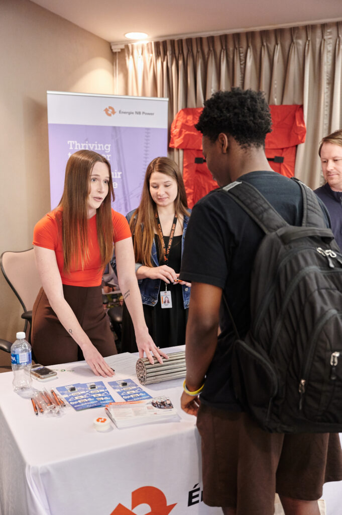 Students speaking with professionals from NB Power 