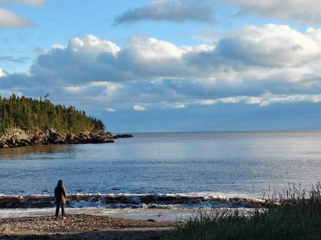 A photo of a woman on a Bay of Fundy beach 